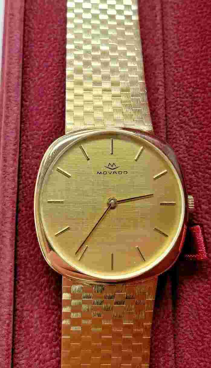 Movado Zenith 14k Mens wristwatch    windup mechanical movement.  87 GRAMS