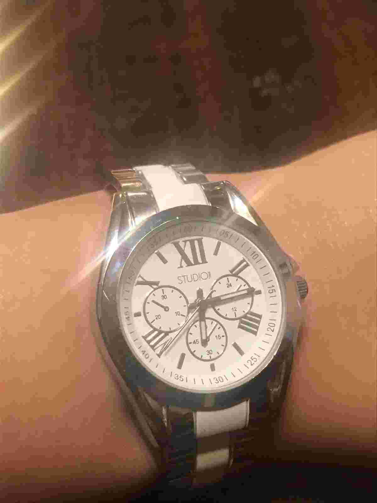 STUDIO WOMENS SILVERTONE FILIGREE CUFF WATCH  White Singapore Movement’s