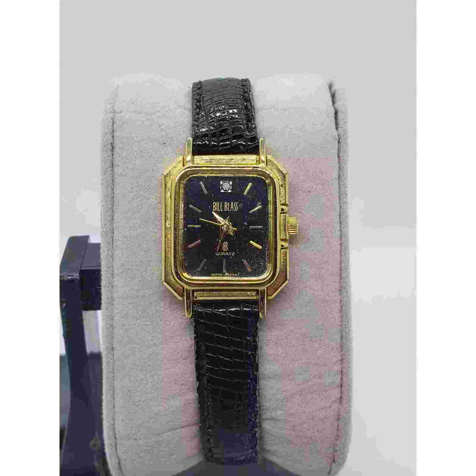 Bill Blass women's watch, 300-2Y51. Blue square face with gold accents