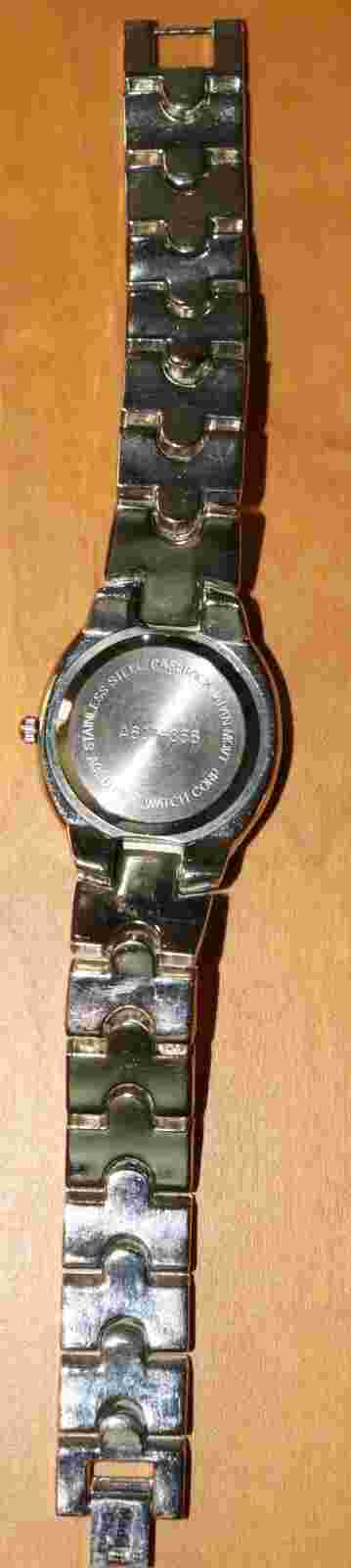 Ladies Analog Quartz Watch Small, 6" band , 5/8" wide Faux-pearl face.