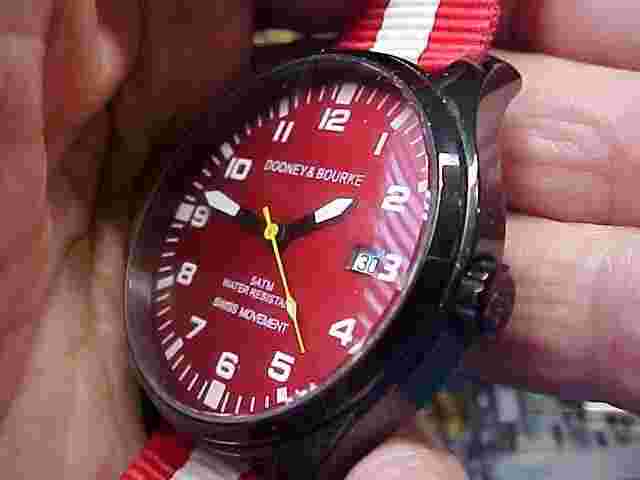 NICE LADIES DOONEY AND BOURKE WATCH 41MM RED DIAL SWISS