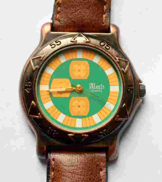 VINTAGE ALEXIS QUARTZ GREEN DIAL WATCH