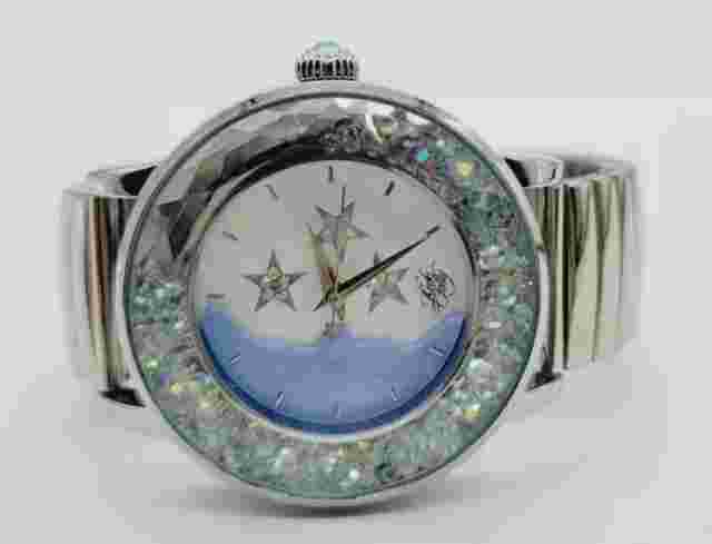 KIRKS FOLLY WATCH SILVERTONE STRETCH BAND BLUE CRESCENT MOON FACE