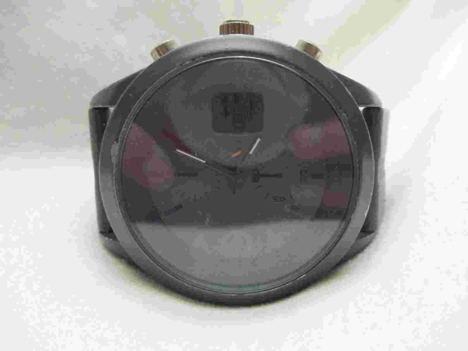 Unlisted Analog Wristwatch with a Buckle Band