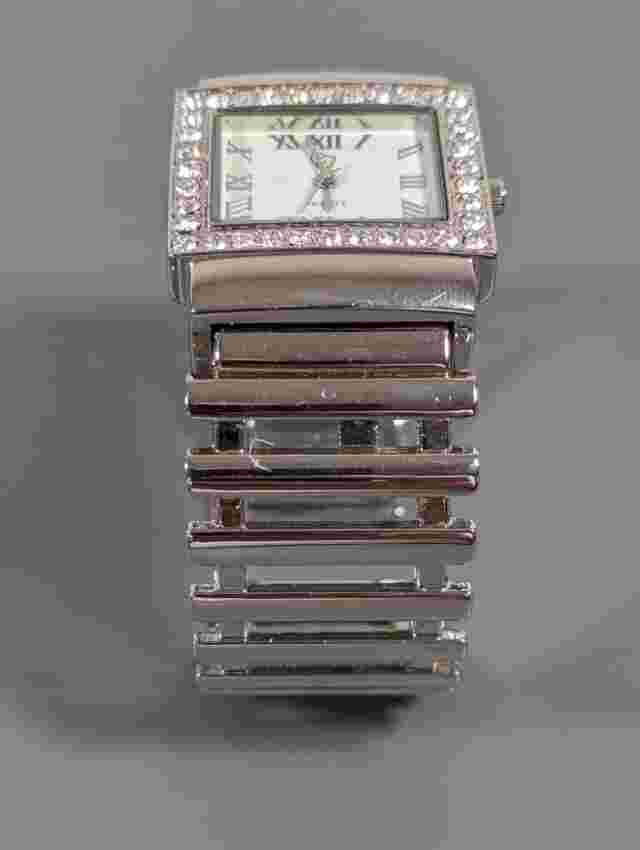 Charming Charlie White Dial Crystal Accent Silver Tone Case Hinge Bracelet Watch