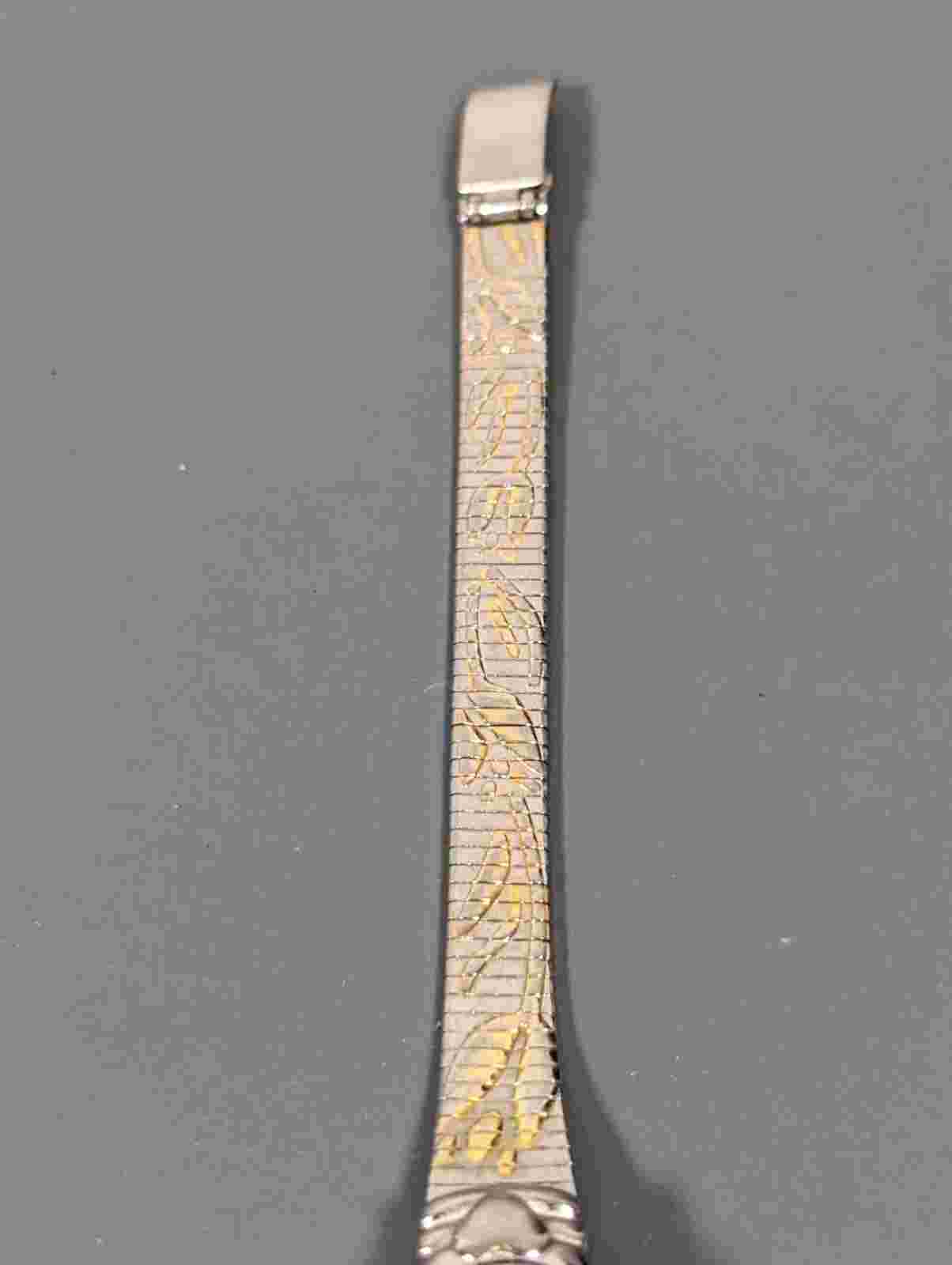 Gloria Vanderbilt Oval Silver Tone Case Two Tone Stainless Steel Bracelet Watch