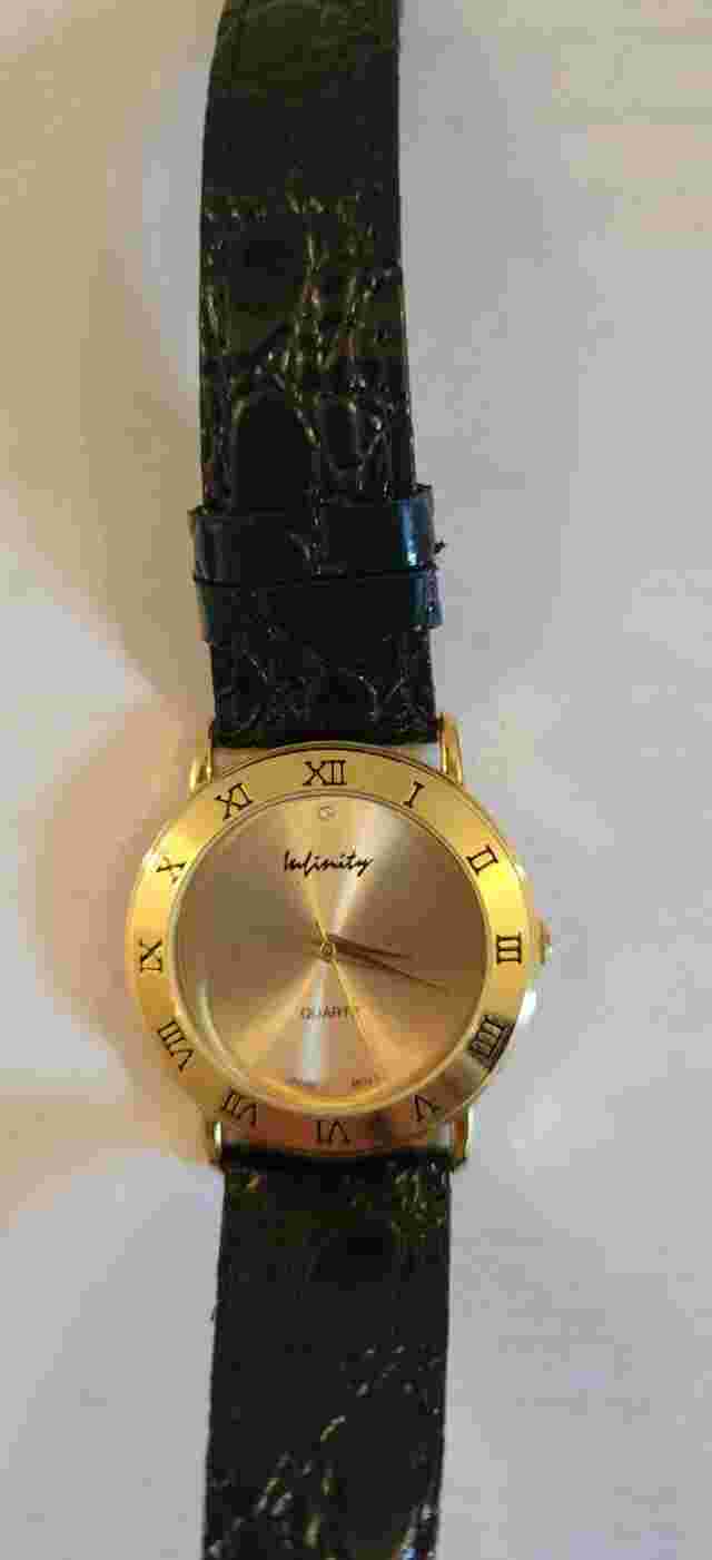 Infinity Gold Tone Dial Round Case Black Leather Band Watch. Not Tested