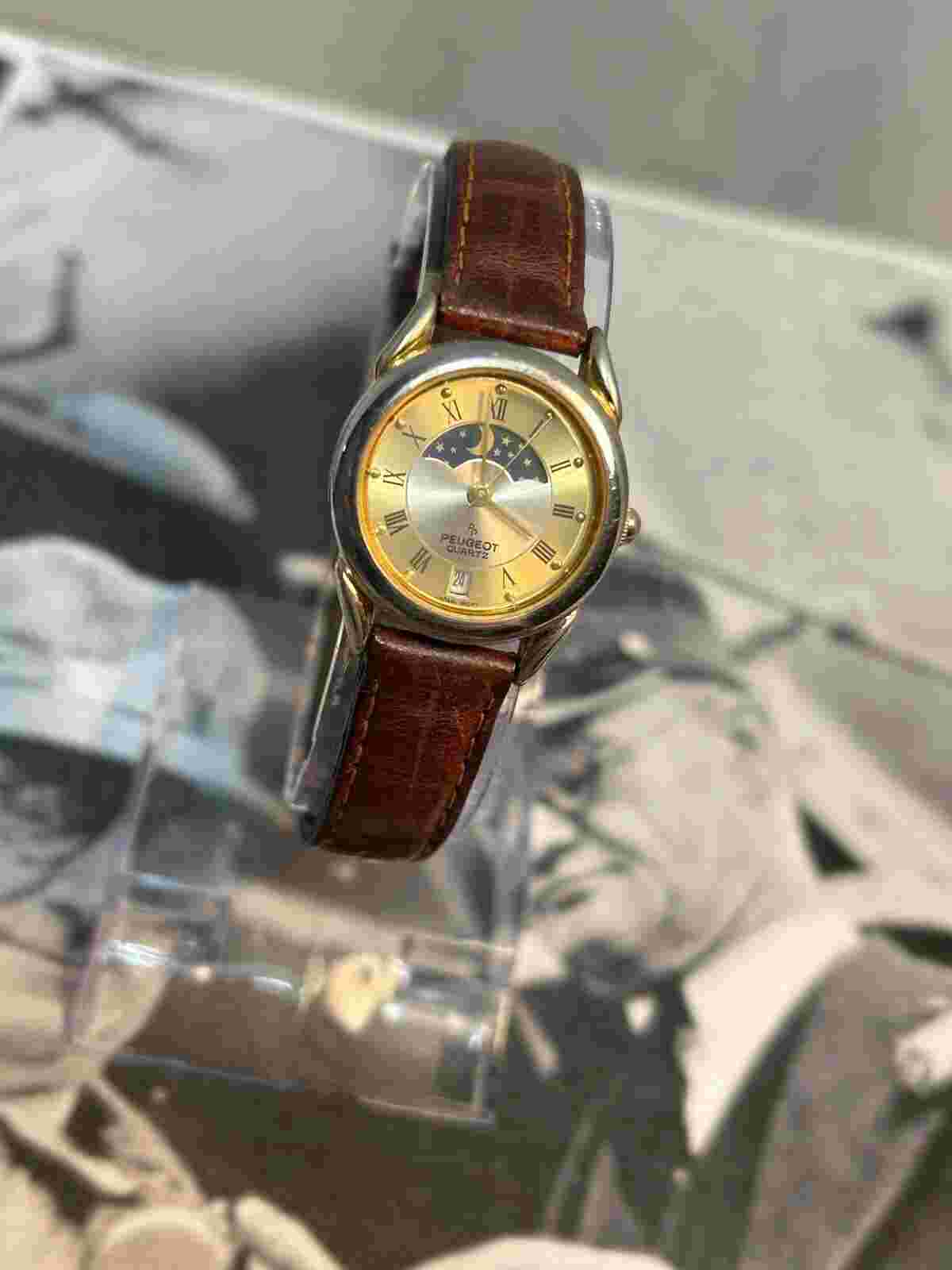 Vintage Women’s Gold Tone Peugeot Quartz watch W/ Day, Night Indictor. Running!