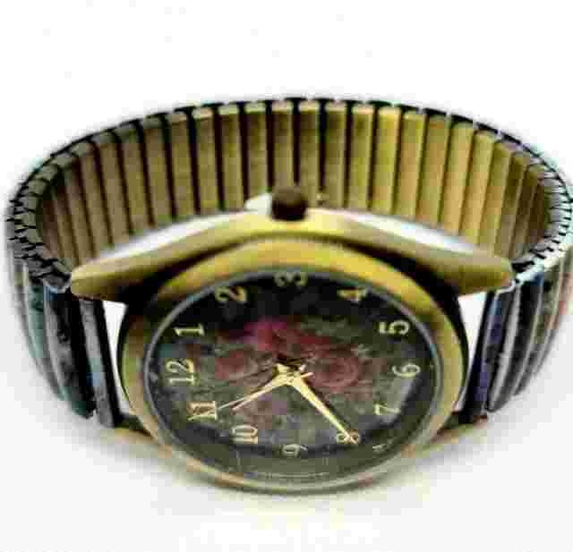 Quartz Watch By Michal Negrin Elastic Metal Strap With Shades Of Purple Flowers.