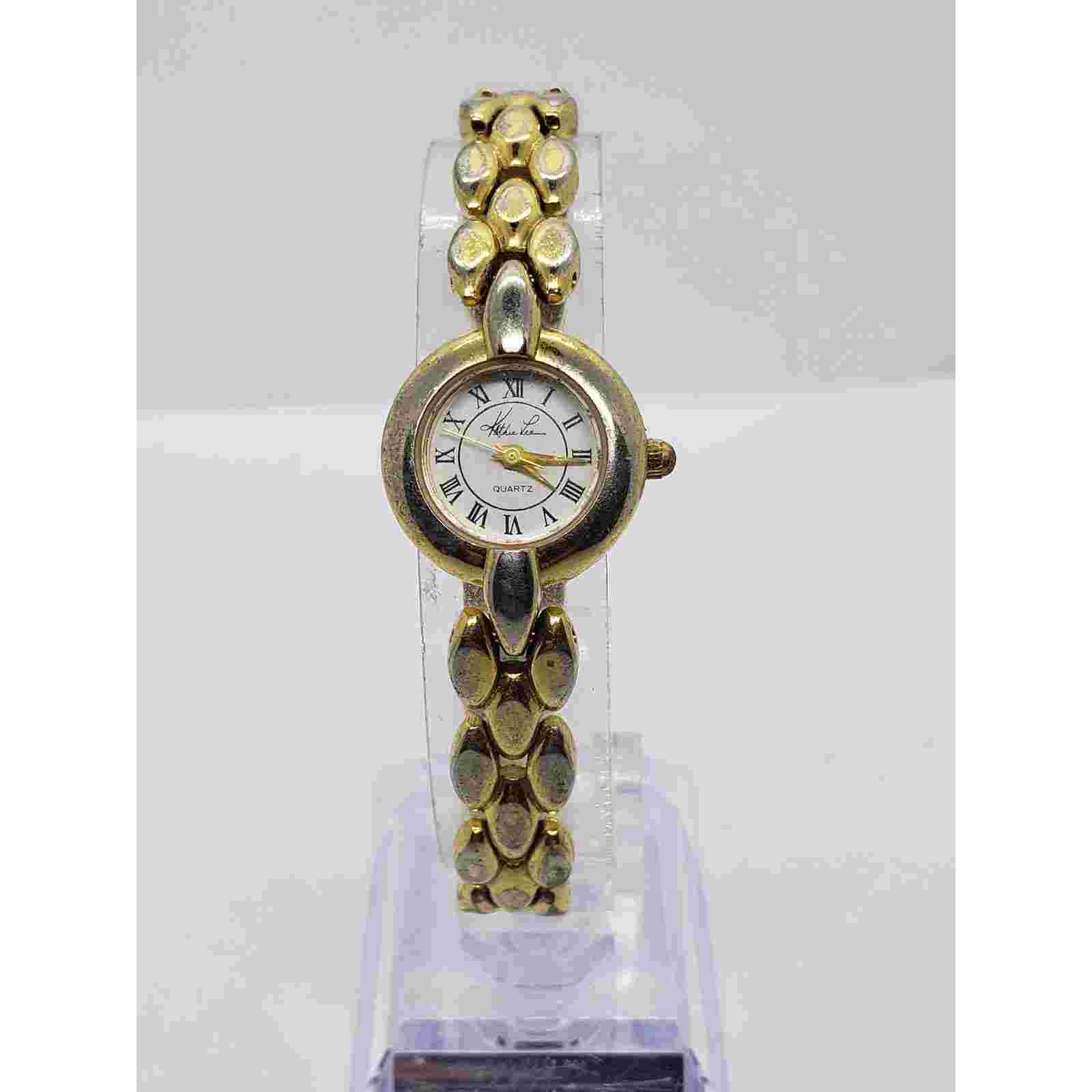 Kathie Lee women's dress watch. 77/5034 753 Small round face with gold accents