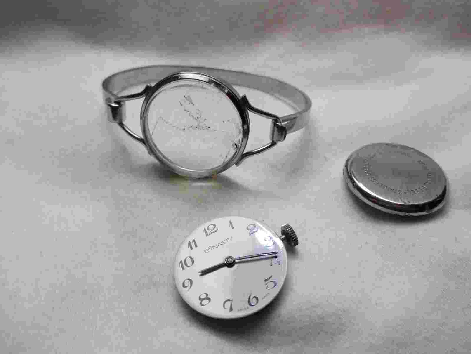 Dynasty Swiss Made Wind Up Wristwatch Silver Toned Round White Face FOR REPAIR