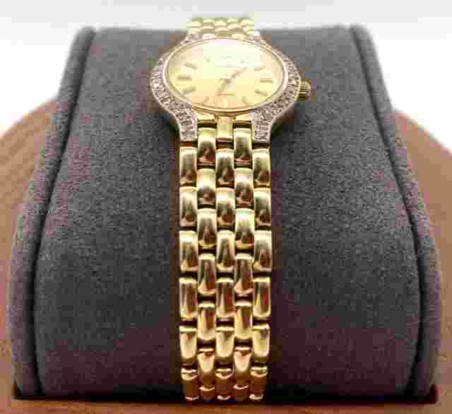 Lucien Piccard 14K Yellow Gold Ladies Round Face Watch w/ Diamond Bezel