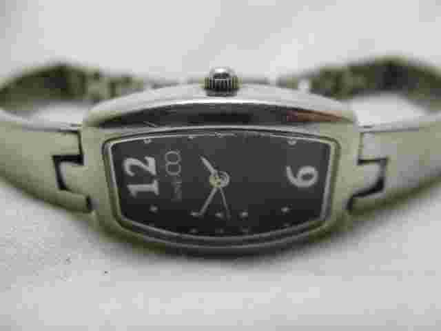 Nine & Co Analog Wristwatch Silver Tone Band Rectangular Black Face