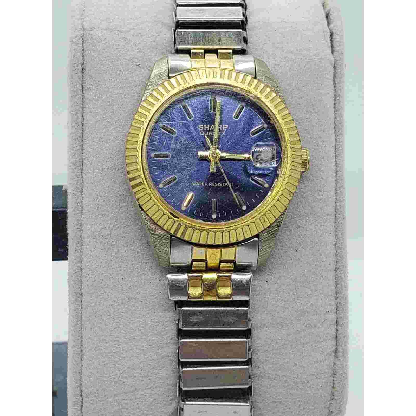 Sharp women's watch, 365384. dark blue iridescent face. Calendar on face