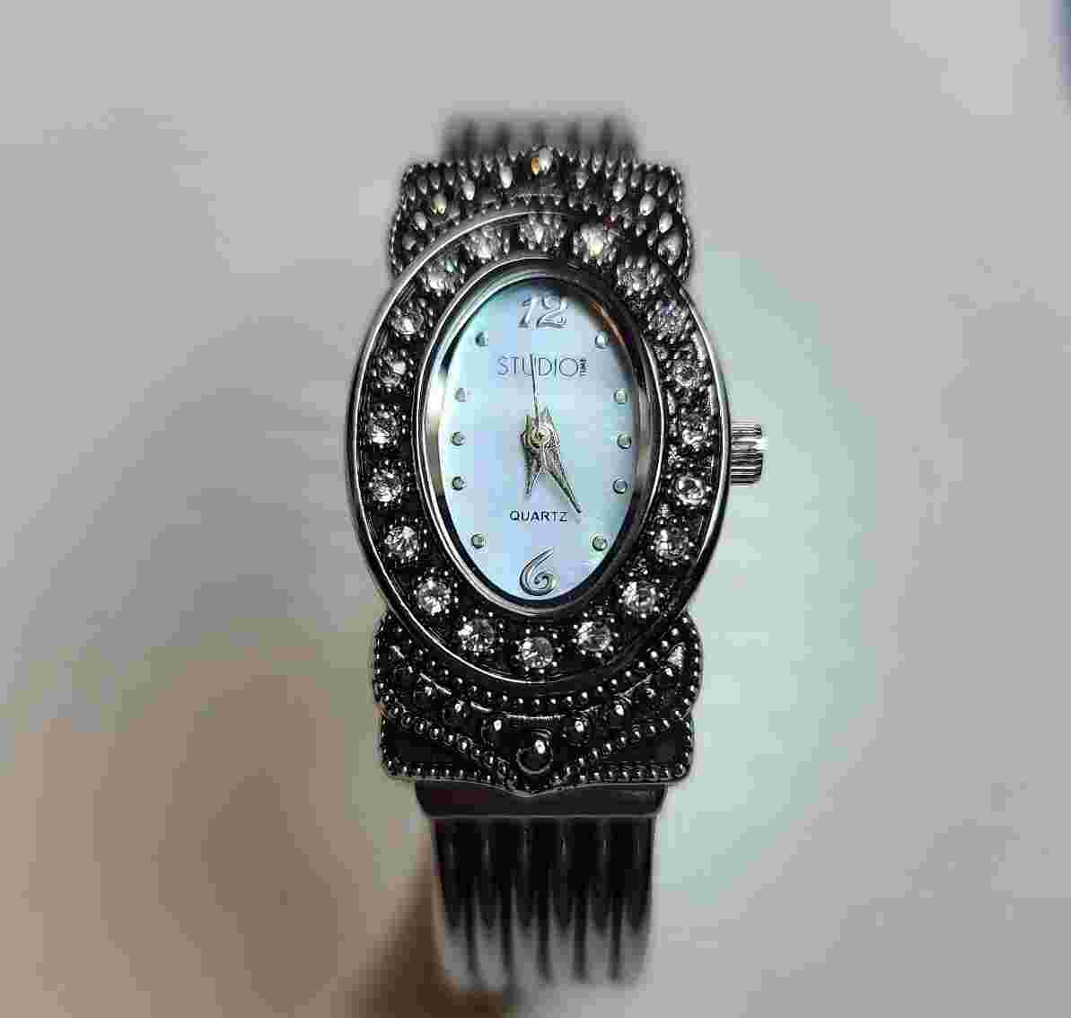 Studio Quartz Ladies Watch Silver Toned With Rhinstones. Mother of Pearl face.