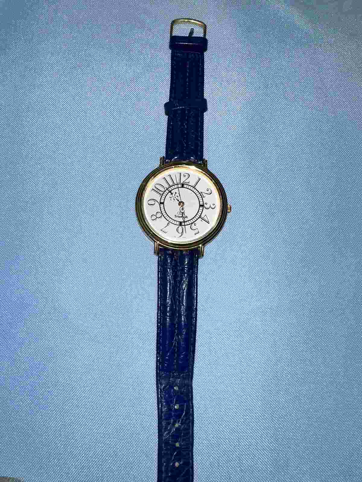 Vintage Triumph Watch - gold toned + blue band - untested