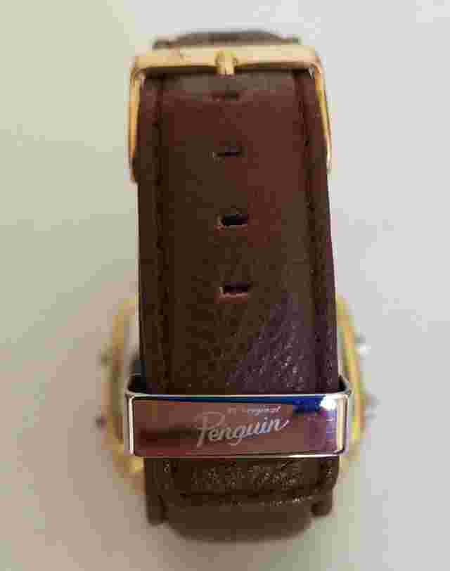 Penguin designer golden wrist watch with brown leather strap