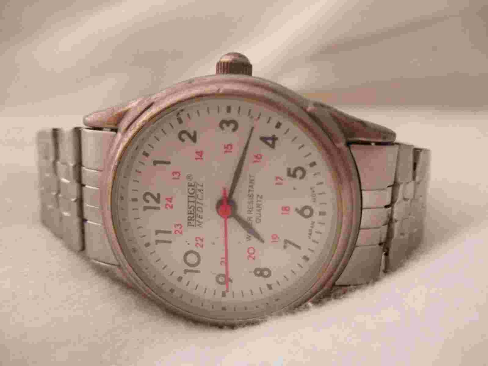 Prestige Medical Watch Round White Face Silver Toned Stretchy Band WORKING!