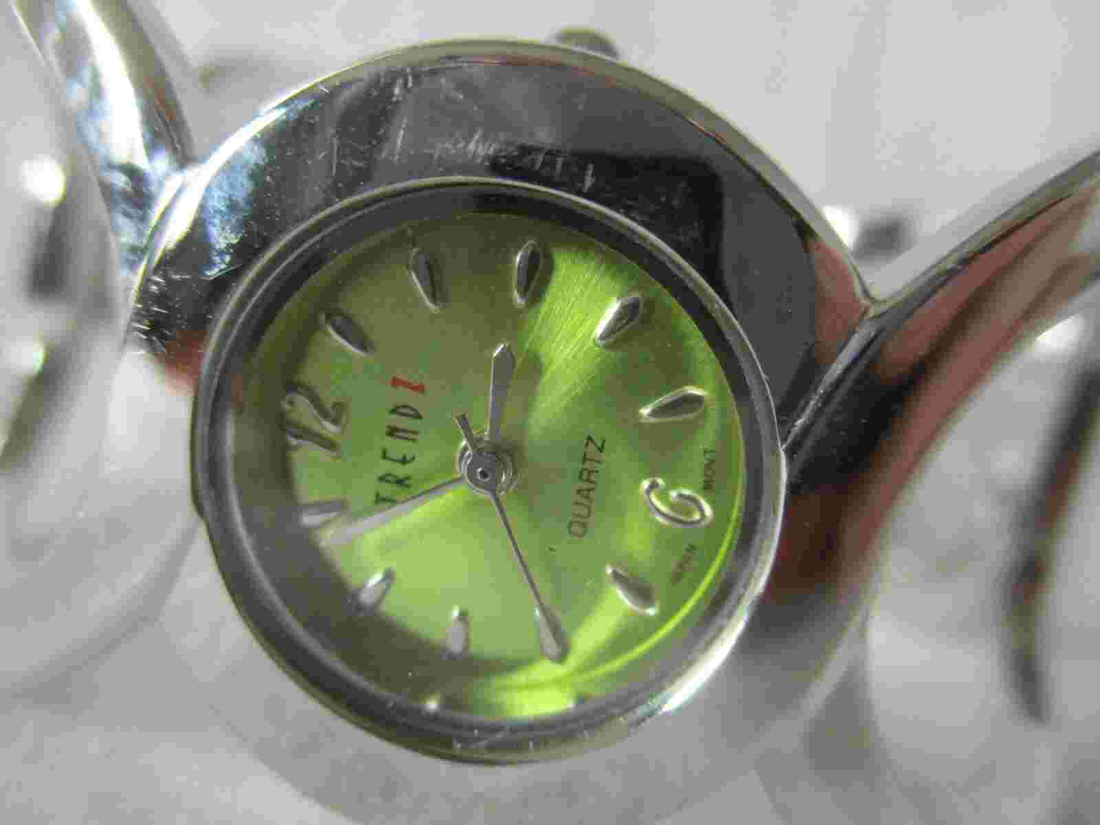 Trendz Wristwatch Silver Tone Cuff Band Round Green Face