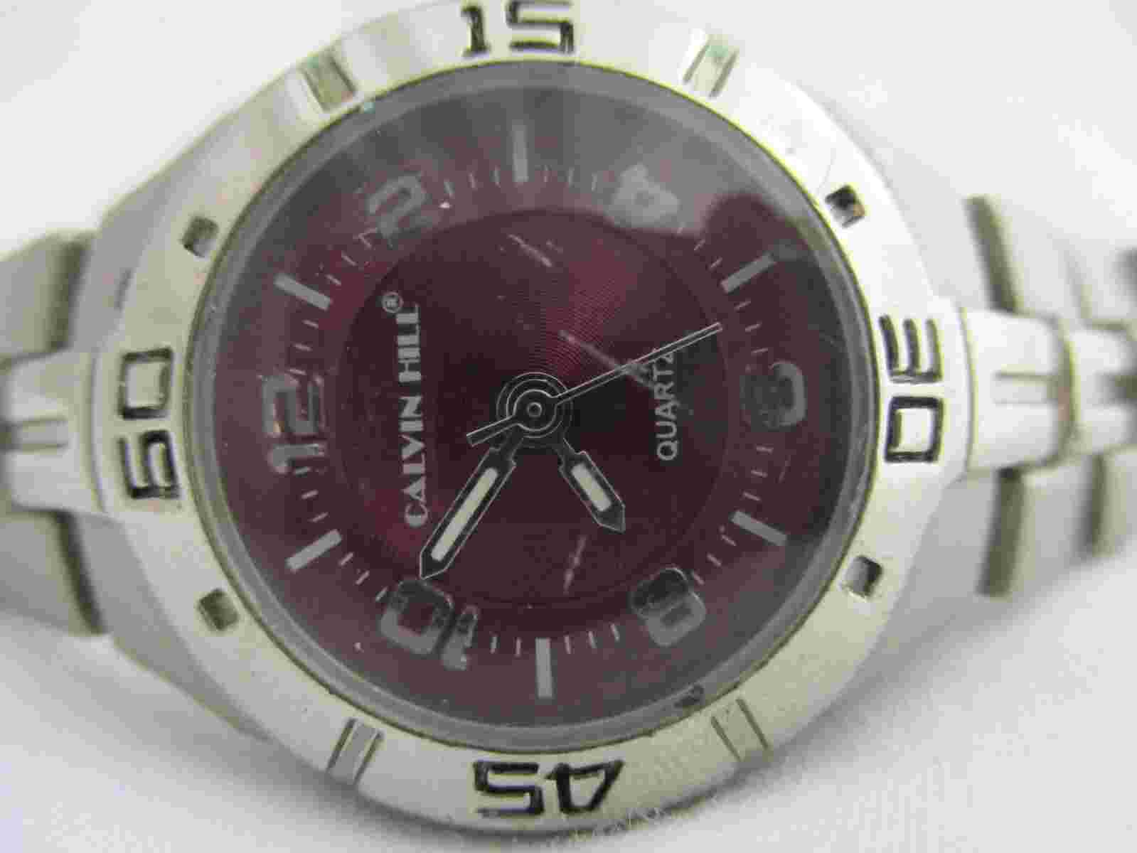 Calvin Hill Analog Wristwatch Silver Tone Stainless Steel Band Round Maroon Face