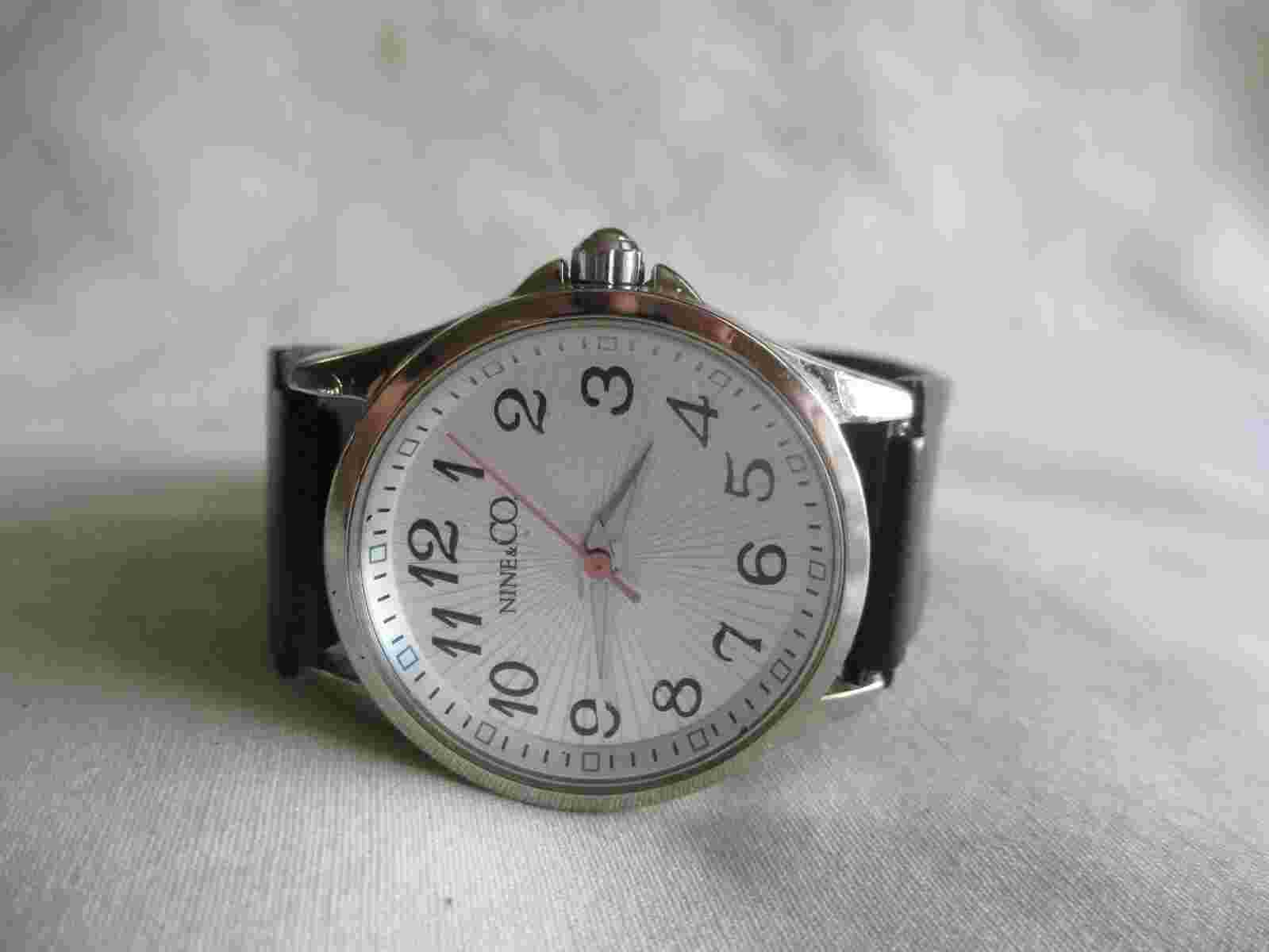 Nine & Co Analog Wristwatch with a Buckle Band