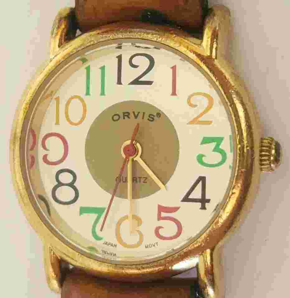 Orvis Gold Tone Ladies Watch w/Multicolored Band & Dial- New Battery