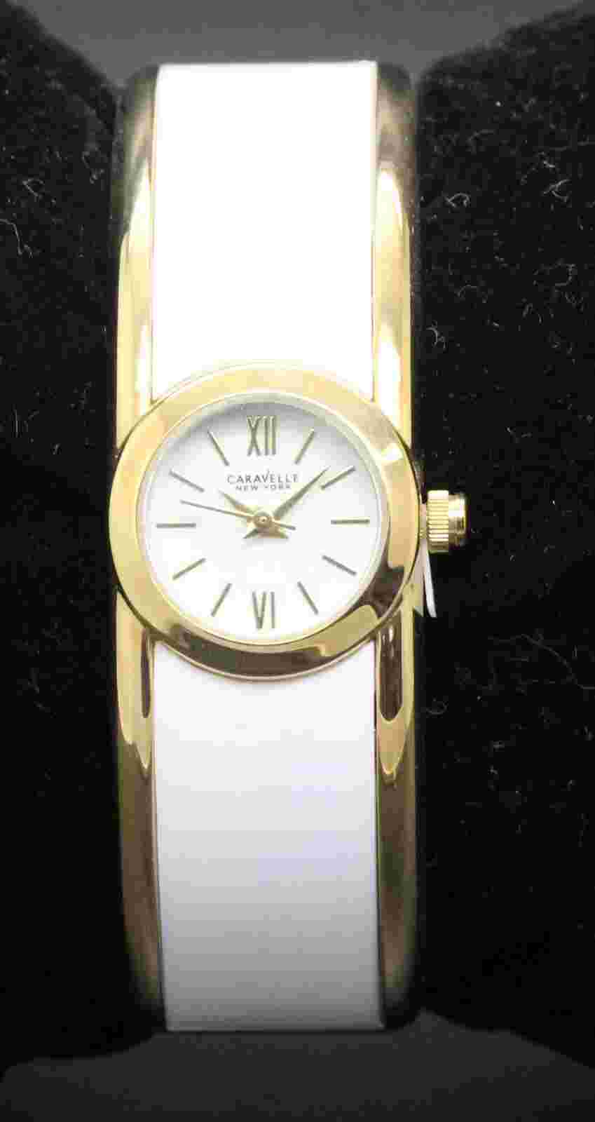 New With Tags Ladies Caravelle Gold Tone and white enamel hinged bangle watch
