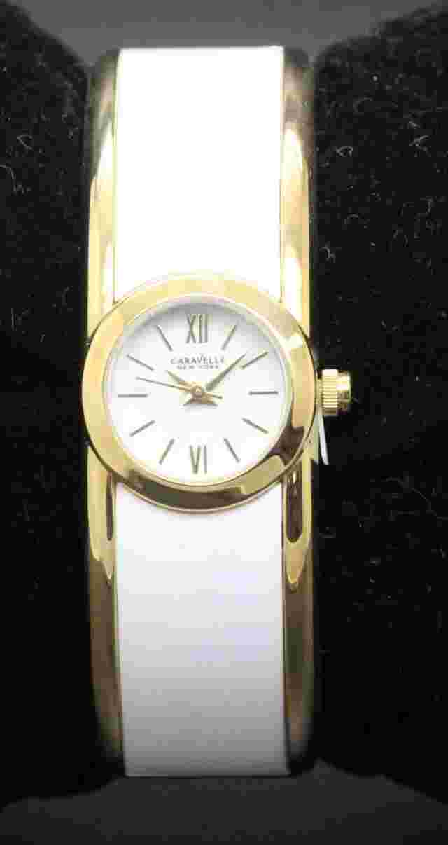 New With Tags Ladies Caravelle Gold Tone and white enamel hinged bangle watch