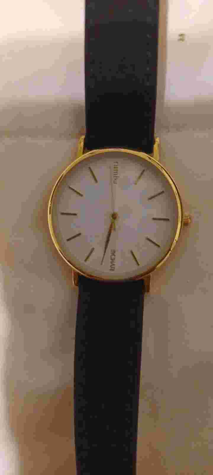 Rumba X Bychari Watch white dial gold and black leather suede band.
