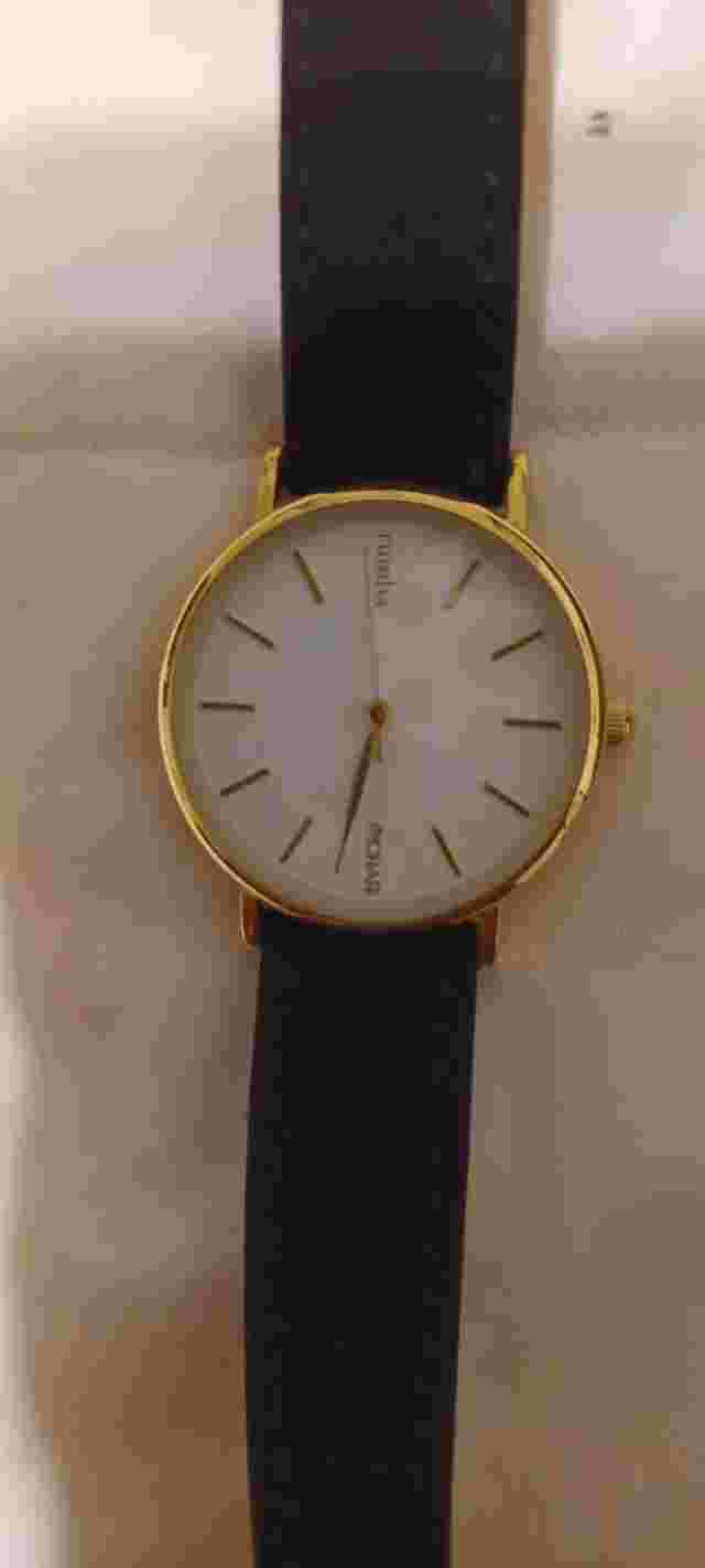 Rumba X Bychari Watch white dial gold and black leather suede band.