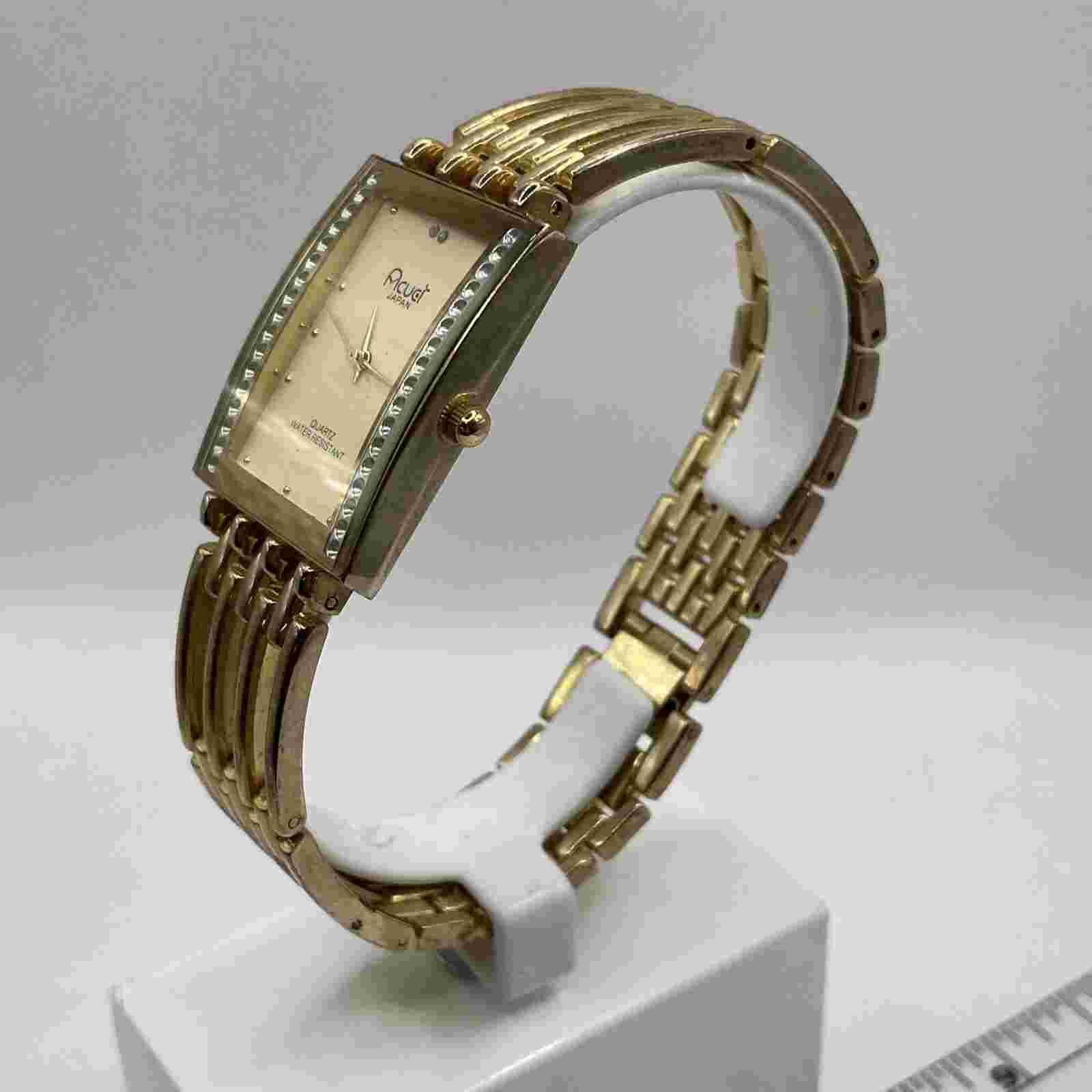Acuet watch women's, gold tone band with clasp.rectangle dial.