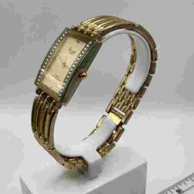 Acuet watch women's, gold tone band with clasp.rectangle dial.
