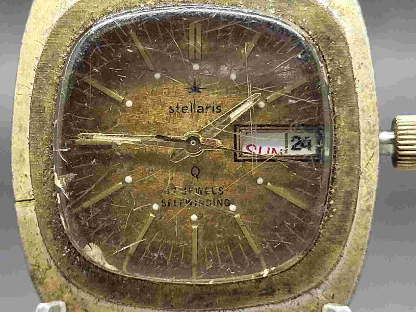 Mans Stellaris Q Gold Tone Day Date 17 Jewel Self Winding Wristwatch Needs Band