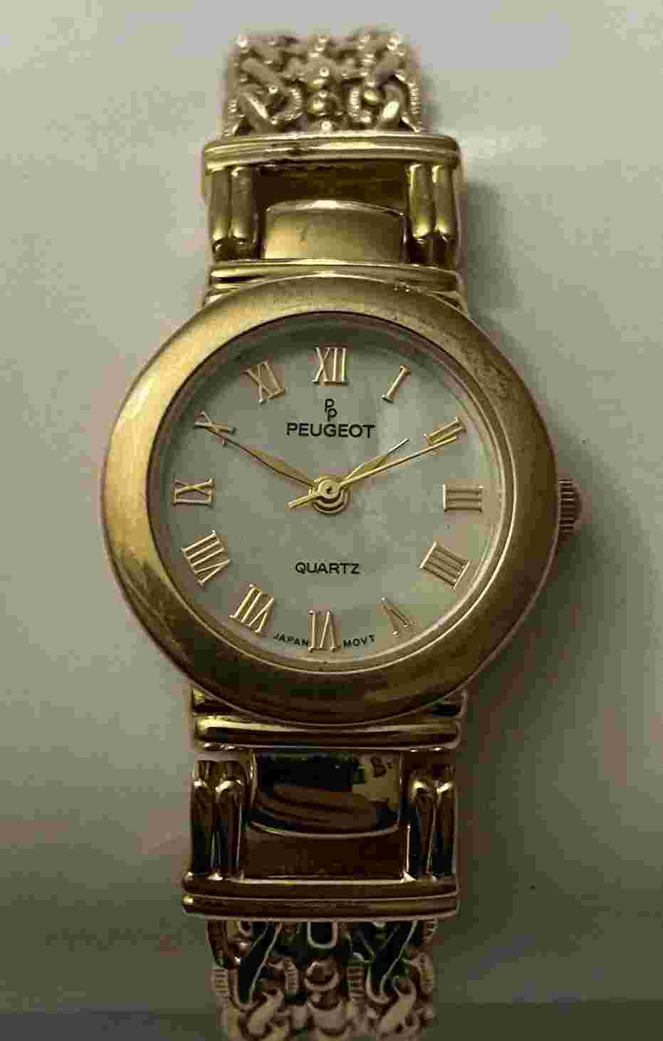PEUGEOT GOLDTONE ADJ.WATCH/MOTHER OF PEARL FACE/INTRICATE DESIGN BRACELET
