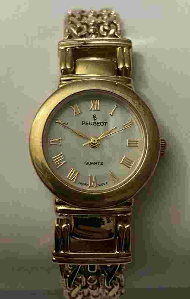 PEUGEOT GOLDTONE ADJ.WATCH/MOTHER OF PEARL FACE/INTRICATE DESIGN BRACELET