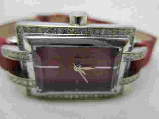 Nicole Analog Wristwatch Red Buckle Band Silver Tone Rhinestones