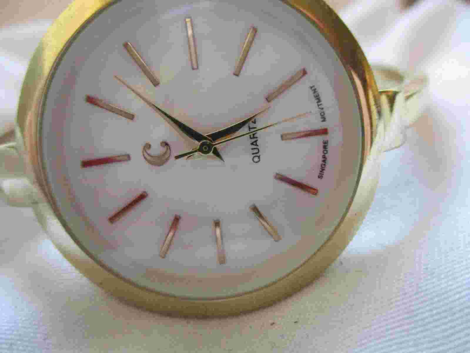 Charming Charlie Analog Wristwatch with a Cuff Band and Quartz Movement