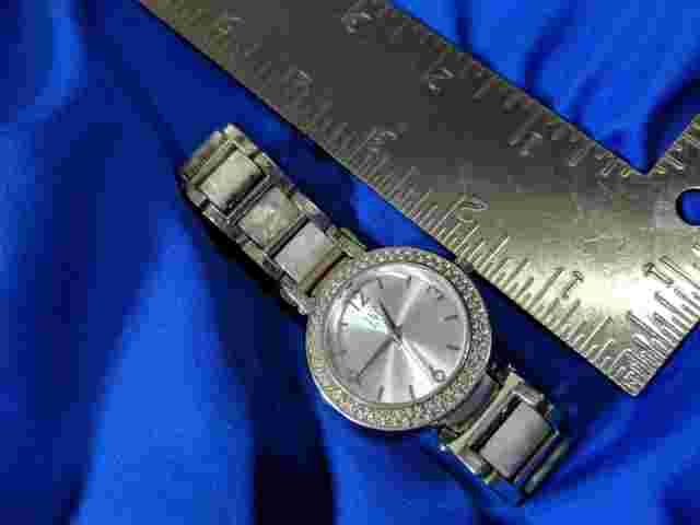 INC MOTHER OF PEARL silver tone band watch, new battery a few scratches A35
