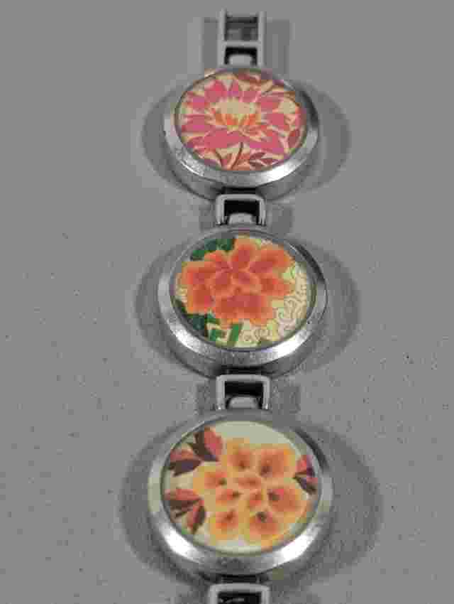 Gossip Brown Dial Round Silver Tone Case Colorful Flower Link Band Watch