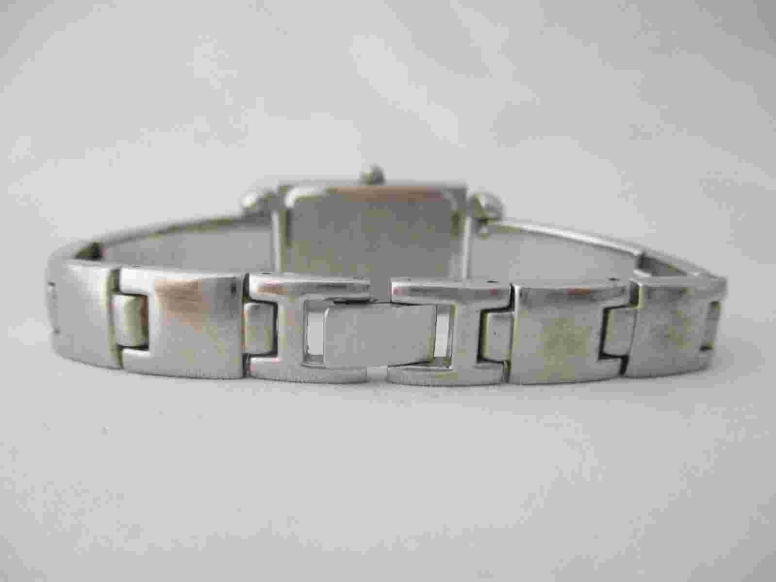 Geoffrey Beene Women's Silver Toned Bracelet Band Analog Watch