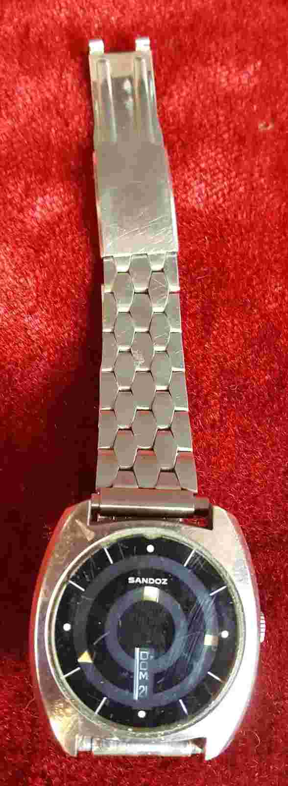 WRIST WATCH. SANDOZ. MYSTERY DIAL. 25 JEWELS. SWITZERLAND. CIRCA 1970.