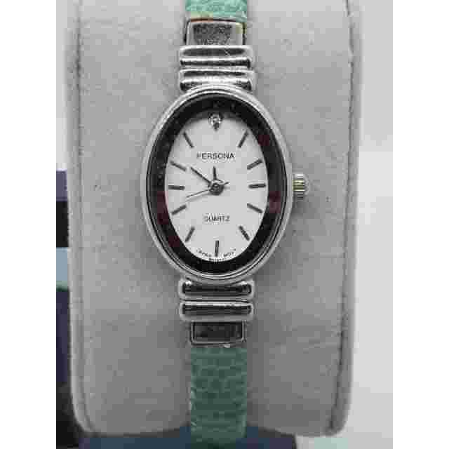Persona women's watch. Green leather bangle band. Jewel on watch face