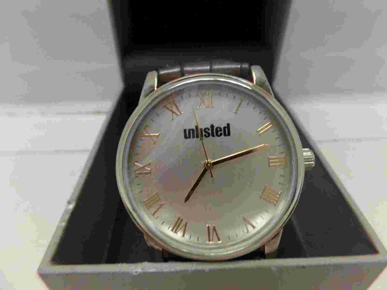 Mens dress unlisted watch. Leather band 10032009