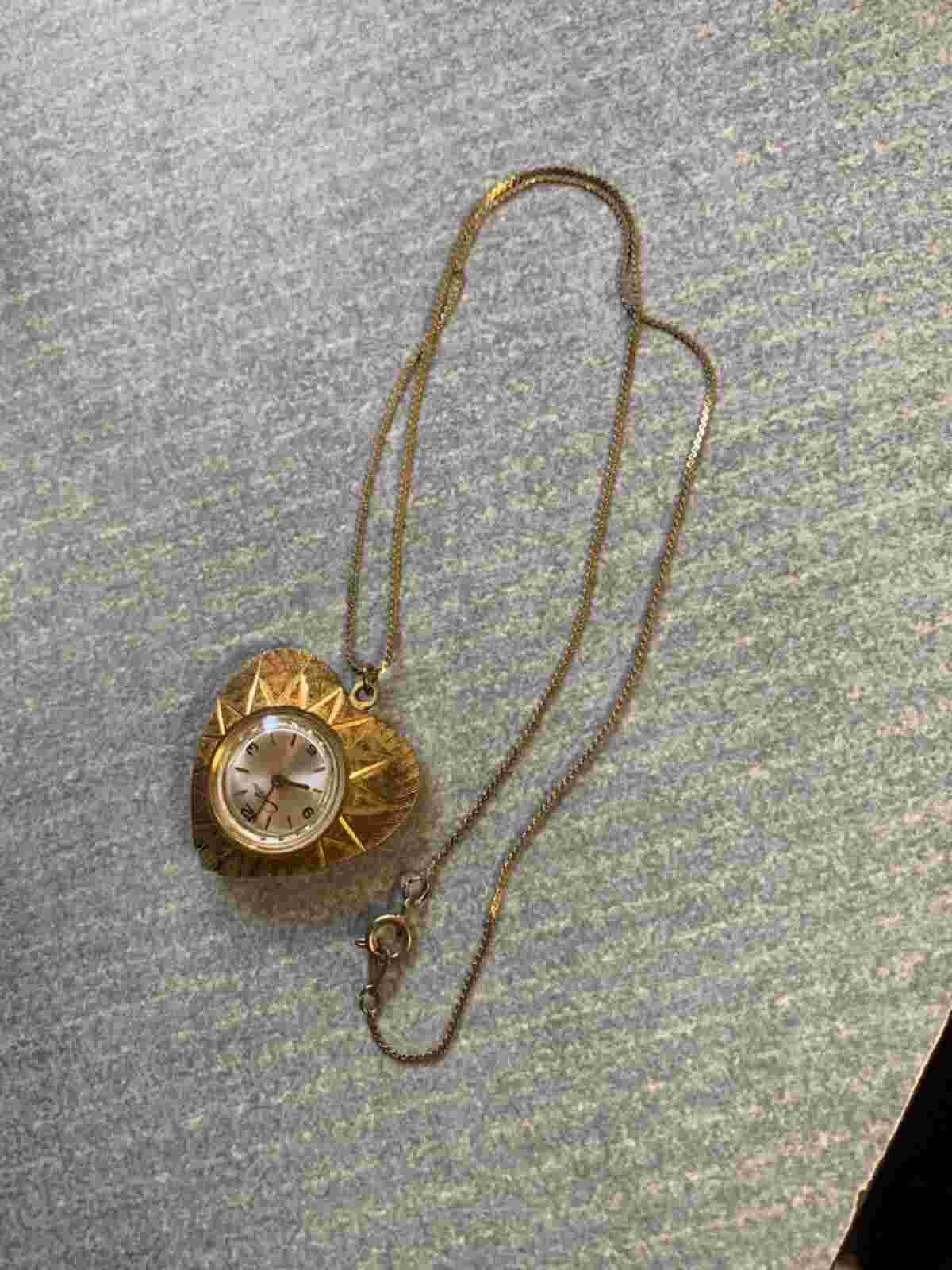 Vinyage Chateu Wind Up Watch on a Gold Colored Chain