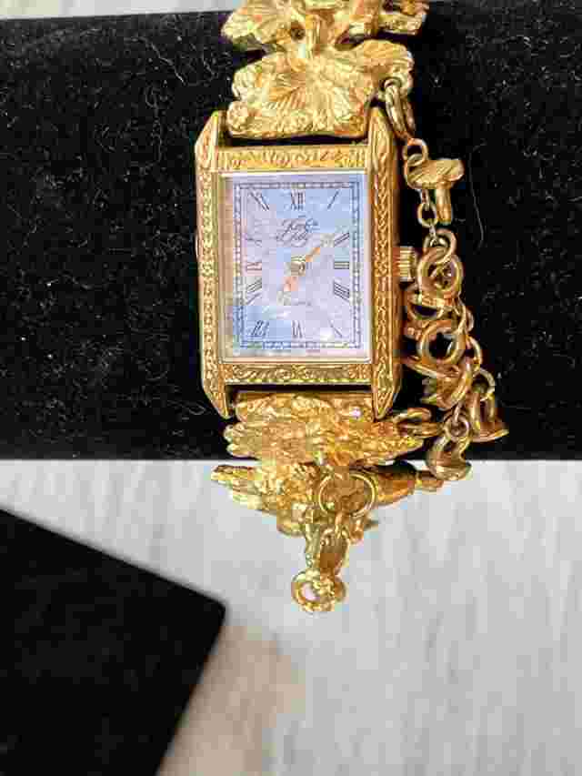 Vintage Kirks Folly Gold Tone Cherub  Phase Stars Charm Watch