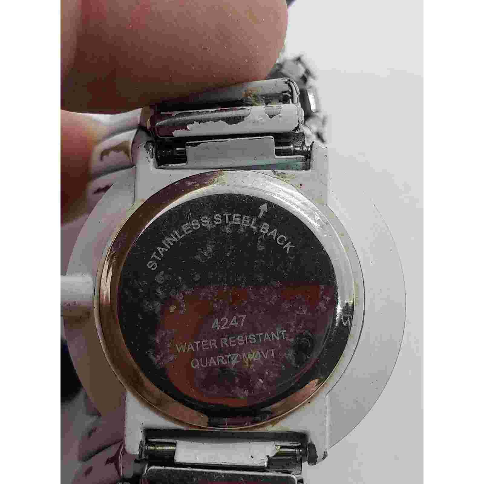 Milano Expressions women's watch. White face with black numbers. Sold as is
