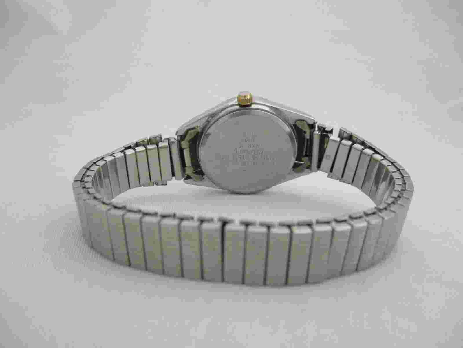 Nelsonic Women's Silver Toned Stretch Band Analog Watch Date Indicator