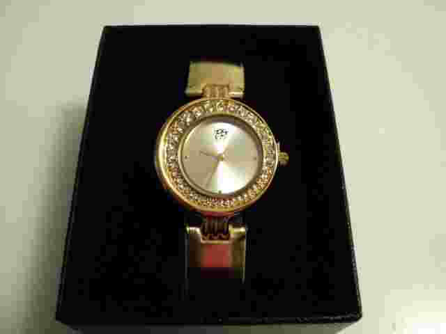 White diamonds Elizabeth Taylor gold watch  New    Very dressy