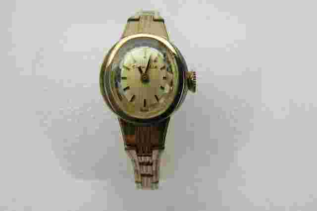 Vintage Caravelle 17 Jewel Ladies Watch with Gold Tone Case and Integrated Band