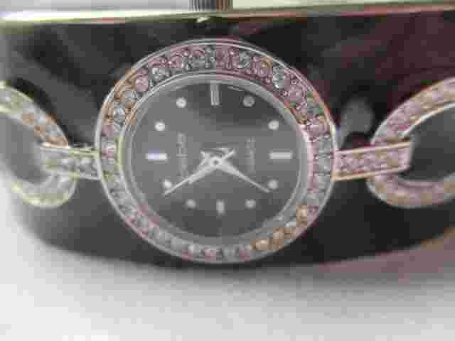 Bebe Analog Wristwatch with a Cuff Band and Quartz Movement